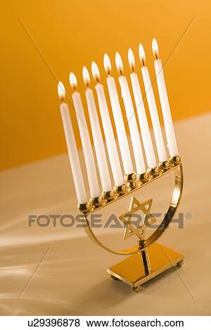 Stock Photo - A fully lit menorah. Fotosearch