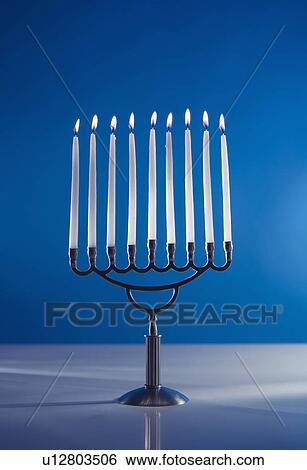 A fully lit menorah View Large Photo Image Stock Photograph - A fully lit menorah. Fotosearch