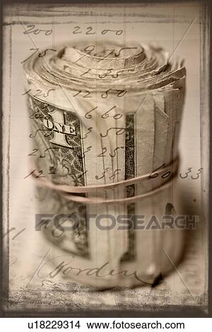 Picture - A roll of cash. Fotosearch
