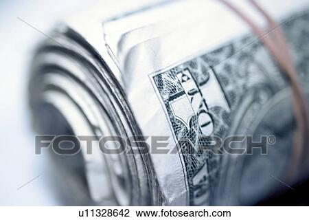 Stock Image - A roll of cash. Fotosearch