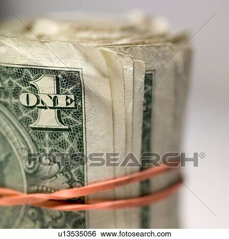 Stock Photograph - A roll of cash. Fotosearch