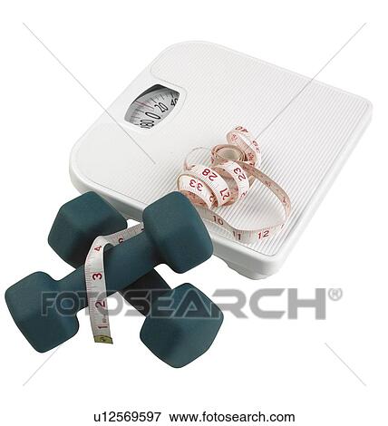 Stock Photo - A scale weights and measuring tape. Fotosearch