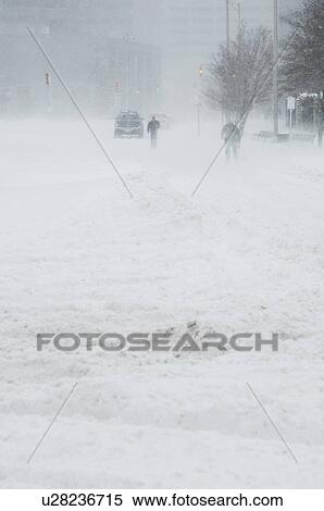 Stock Photography - A snowy winter day in the city. Fotosearch