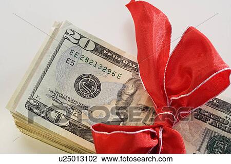 A stack of money with a bow View Large Photo Image Stock Image - A stack of money with a bow. Fotosearch