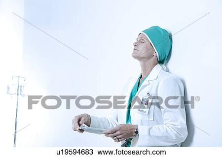 A tired healthcare worker View Large Photo Image Stock Image - A tired healthcare worker. Fotosearch