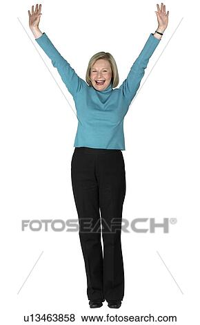 A woman standing with arms outstretched View Large Photo Image Stock Photo - A woman standing with arms outstretched. Fotosearch