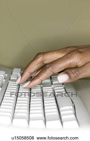 Stock Photo - A woman's hand on computer keyboard. Fotosearch