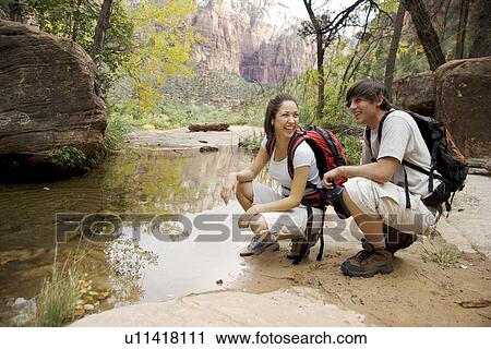 Backpacking couple in Zion National Park Utah USA View Large Photo Image Stock Image - Backpacking couple in Zion National Park Utah USA. Fotosearch