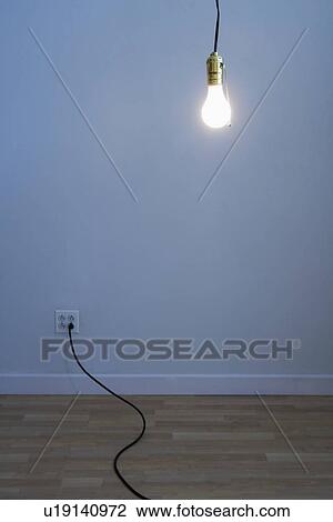 Stock Image - Bare light bulb in empty room. Fotosearch