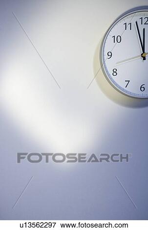 Stock Photo - Bare wall with clock. Fotosearch