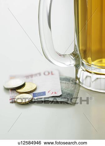 Beer mug and currency View Large Photo Image Stock Photograph - Beer mug and currency. Fotosearch