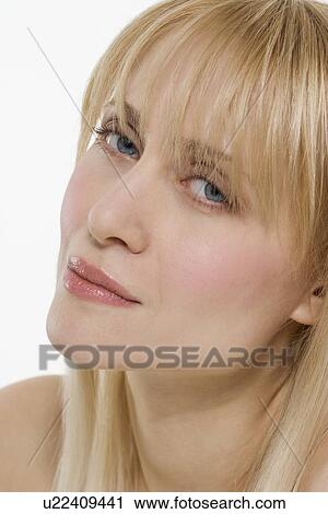 Blond woman with head tilted View Large Photo Image Stock Image - Blond woman with head tilted. Fotosearch