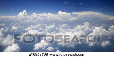 Blue sky and clouds View Large Photo Image Stock Photo - Blue sky and clouds. Fotosearch
