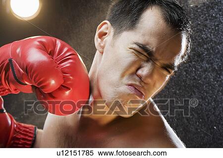 Boxer taking a punch to the head View Large Photo Image Stock Photography - Boxer taking a punch to the head. Fotosearch