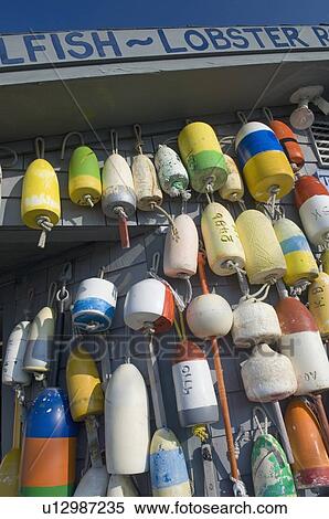 Stock Photography - Buoys hanging on building. Fotosearch
