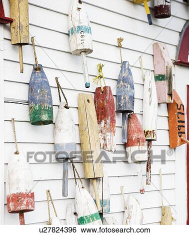 Buoys on a wall in Maine View Large Photo Image Stock Photograph - Buoys on a wall in Maine. Fotosearch