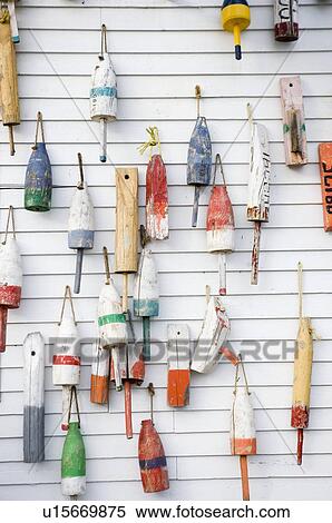 Stock Photography - Buoys on a wall in Maine. Fotosearch