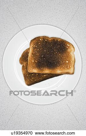 Burned toast on plate View Large Photo Image Stock Image - Burned toast on plate. Fotosearch