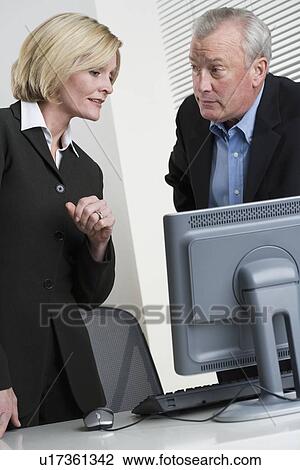 Business people at work View Large Photo Image Stock Image - Business people at work. Fotosearch