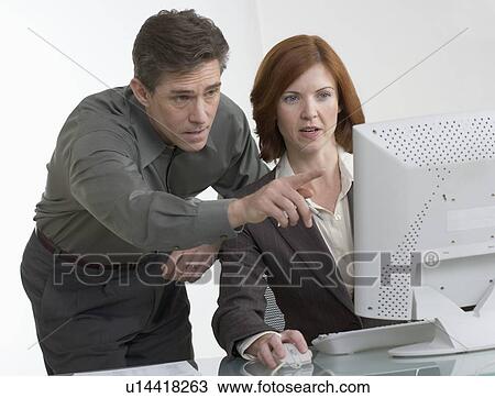 Business people looking at computer screen View Large Photo Image Stock Image - Business people looking at computer screen. Fotosearch