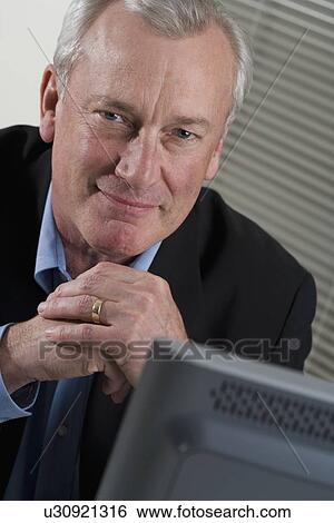 Businessman at work View Large Photo Image Stock Photograph - Businessman at work. Fotosearch