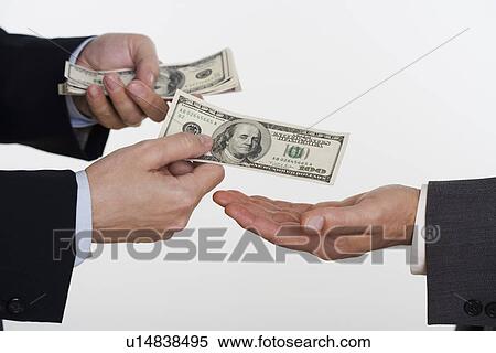 Stock Photography - Businessman giving money to a man. Fotosearch