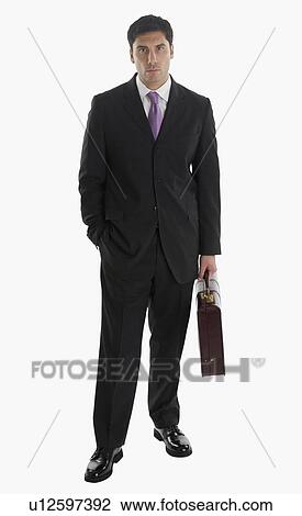 Businessman holding briefcase View Large Photo Image Stock Image - Businessman holding briefcase. Fotosearch