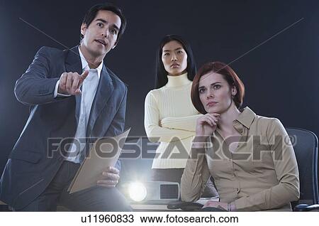 Stock Image - Businessman making a presentation. Fotosearch