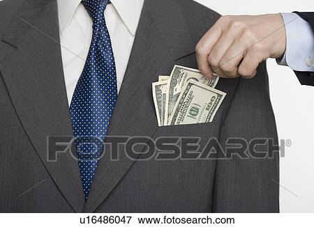 Stock Photo - Businessman picking a pocket. Fotosearch