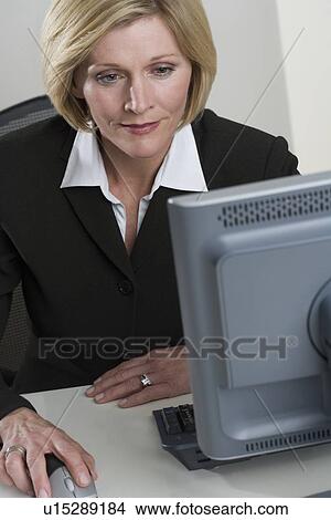 Picture - Businesswoman at work. Fotosearch