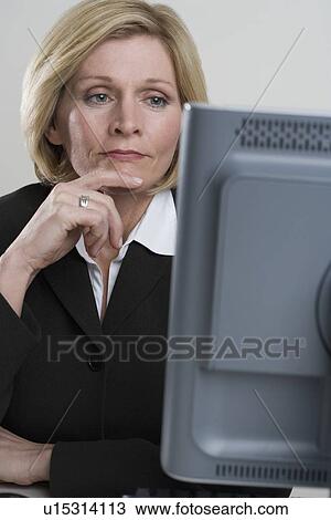 Businesswoman at work View Large Photo Image Stock Image - Businesswoman at work. Fotosearch