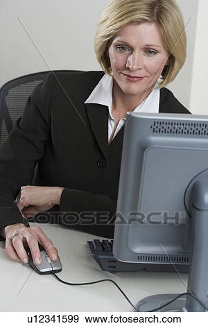 Stock Photo - Businesswoman at work. Fotosearch