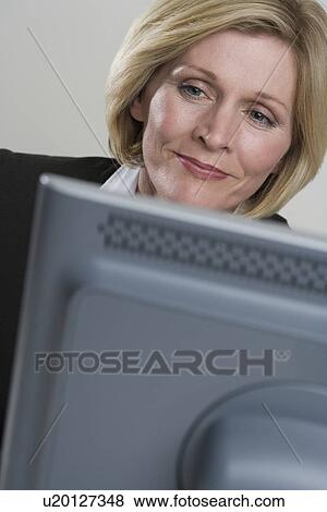 Stock Photo - Businesswoman at work. Fotosearch