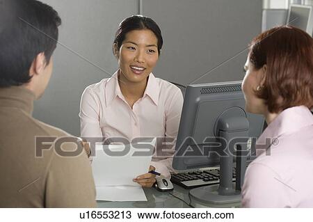 Businesswoman talking to couple View Large Photo Image Stock Image - Businesswoman talking to couple. Fotosearch