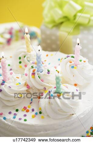 Stock Photo - Cake and presents for special occasion. Fotosearch