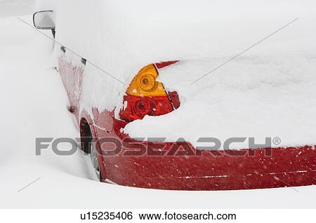 Stock Photograph - Car buried in snow in winter. Fotosearch