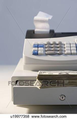 Stock Photo - Cash register with pile of cash. Fotosearch