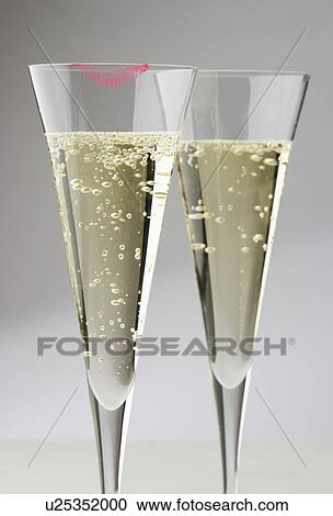 Champagne glasses with lipstick print View Large Photo Image Stock Image - Champagne glasses with lipstick print. Fotosearch