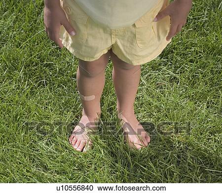 Child standing in bare feet View Large Photo Image Stock Image - Child standing in bare feet. Fotosearch