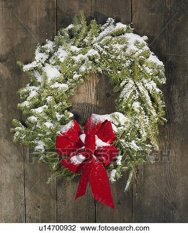 Christmas wreath hung on a wall View Large Photo Image Stock Image - Christmas wreath hung on a wall. Fotosearch