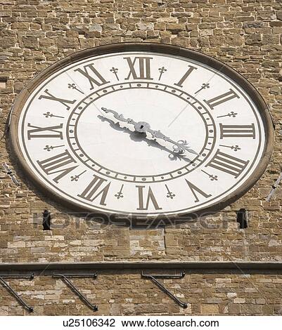 Stock Image - Clock face of the Palazzo Vecchio Florence Italy. Fotosearch