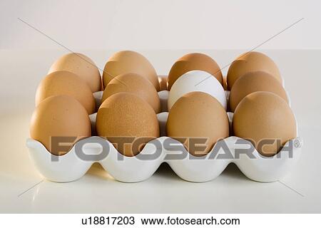 Stock Image - Close up of a dozen eggs. Fotosearch