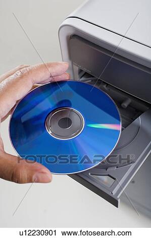 Close up of cd being inserted in to cd rom drive View Large Photo Image Stock Image - Close up of cd being inserted in to cd rom drive. Fotosearch