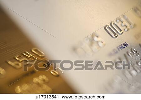 Stock Image - Close up of gold credit cards. Fotosearch