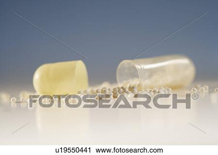 Close up of pill with contents spilled out View Large Photo Image Stock Image - Close up of pill with contents spilled out. Fotosearch