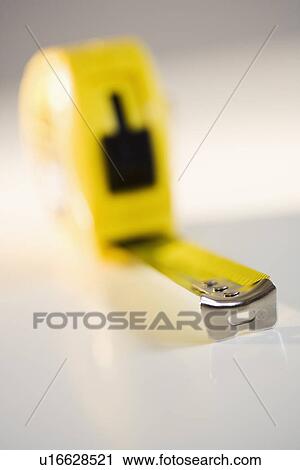 Stock Image - Close up of tape measure. Fotosearch