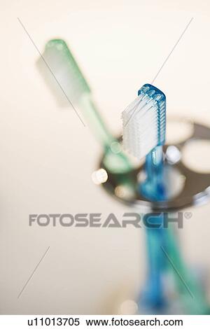 Close up of toothbrushes in holder View Large Photo Image Stock Photography - Close up of toothbrushes in holder. Fotosearch