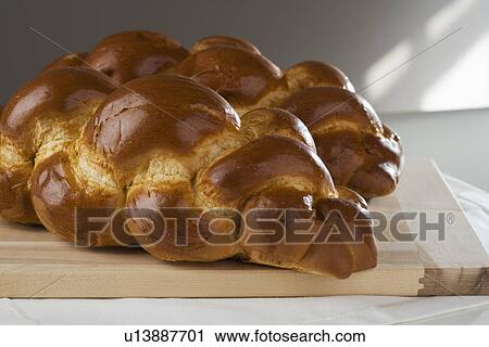 Stock Image - Close up of two loaves of Challah bread. Fotosearch