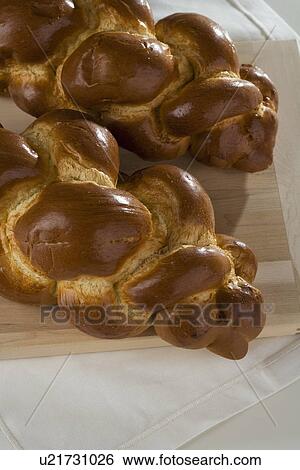 Close up of two loaves of Challah bread View Large Photo Image Stock Photograph - Close up of two loaves of Challah bread. Fotosearch