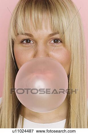 Close up of woman blowing bubble with bubble gum View Large Photo Image Stock Photo - Close up of woman blowing bubble with bubble gum. Fotosearch